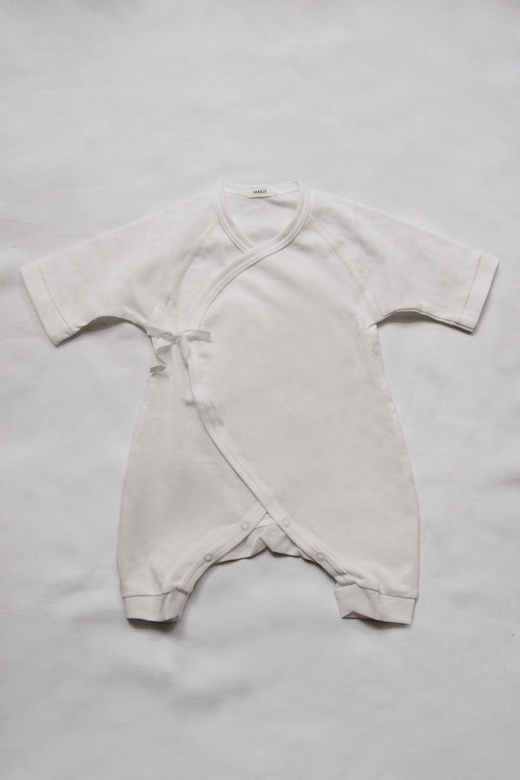 Baby kimono bodysuit for newborn by Makie "First Hadagi" in white.