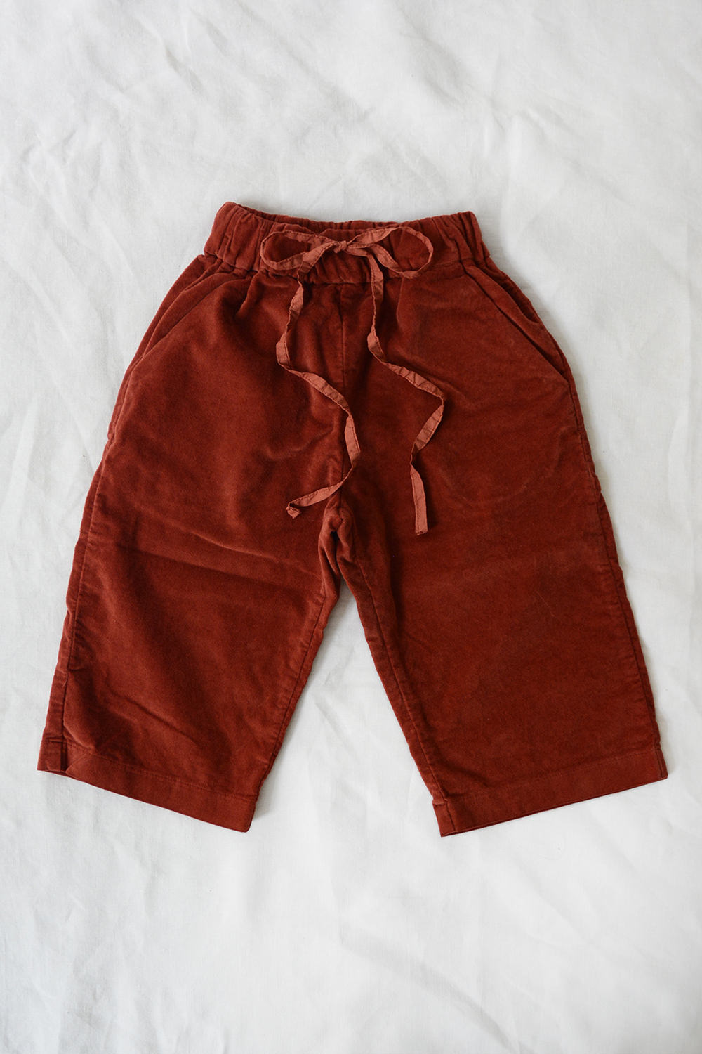 album di famiglia kid's velvet trousers in red top picture