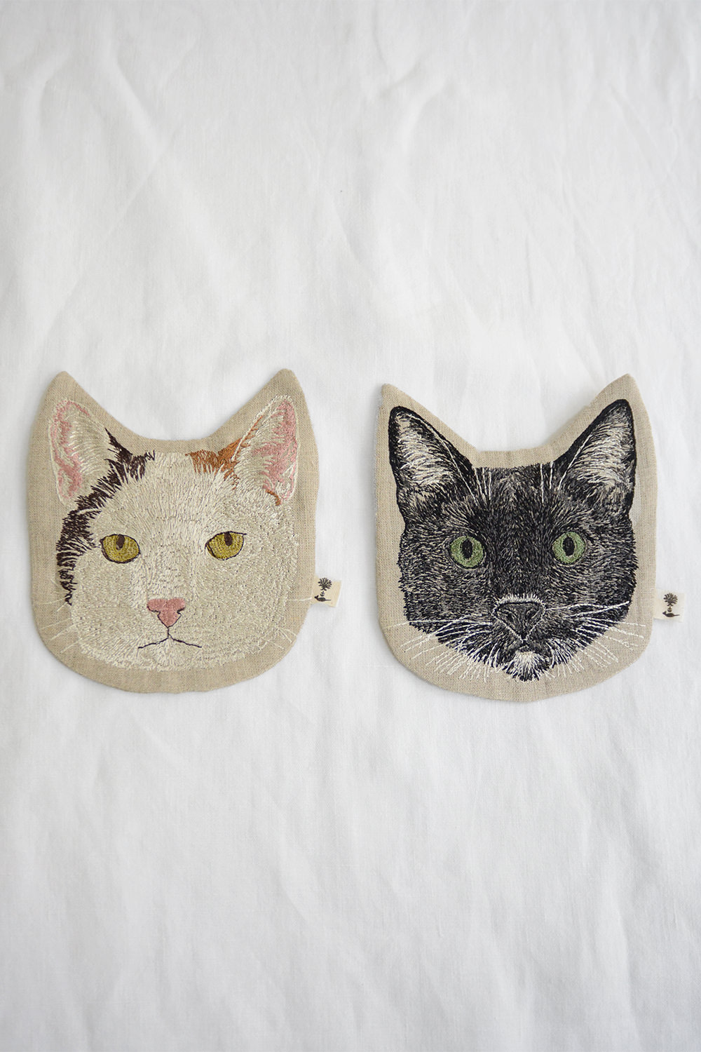Coral and Tusk Black Cat and White Cat Pouch Top Picture