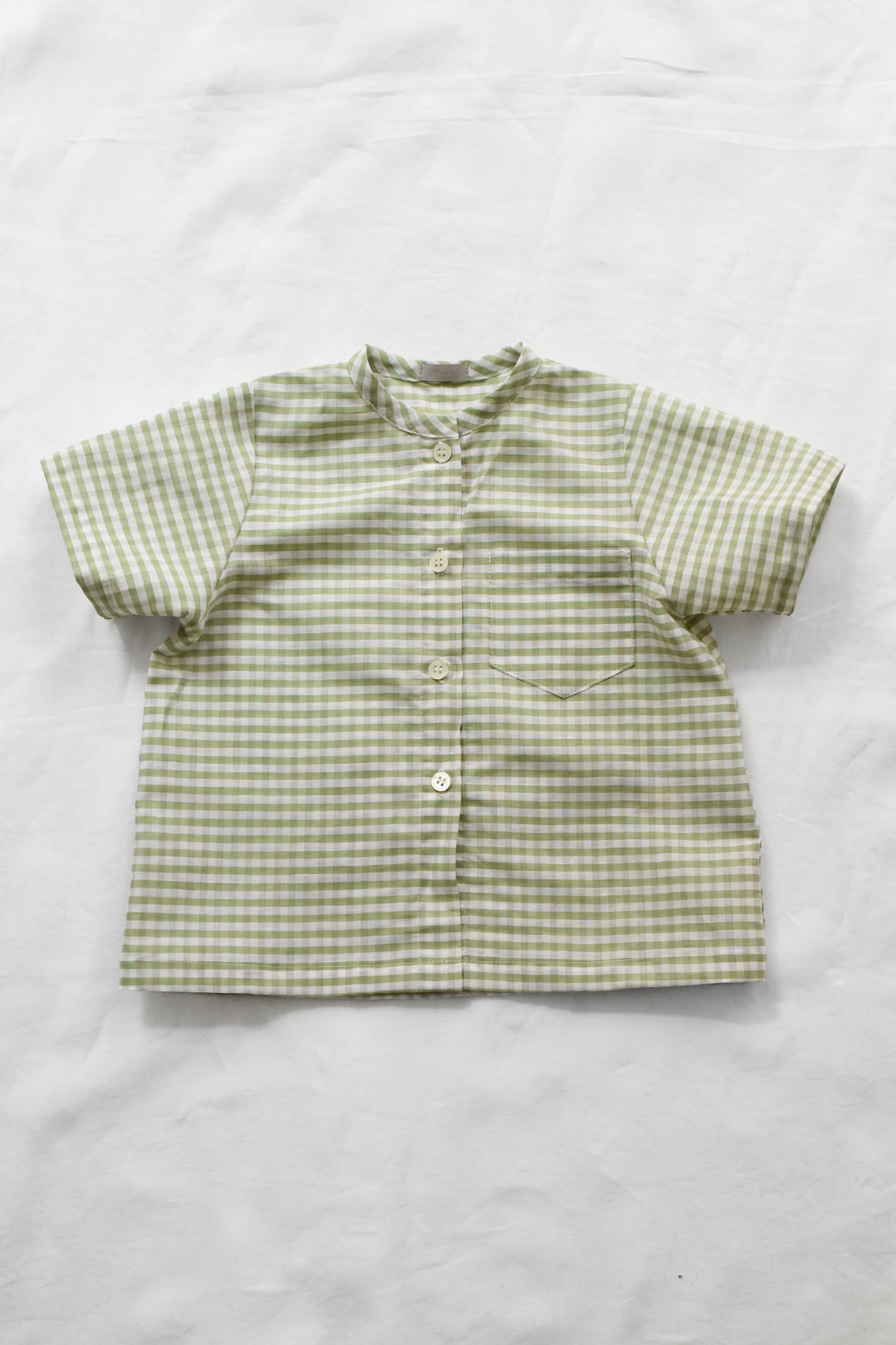 Italian gingham baby shirt in soft green with short sleeves and front buttons