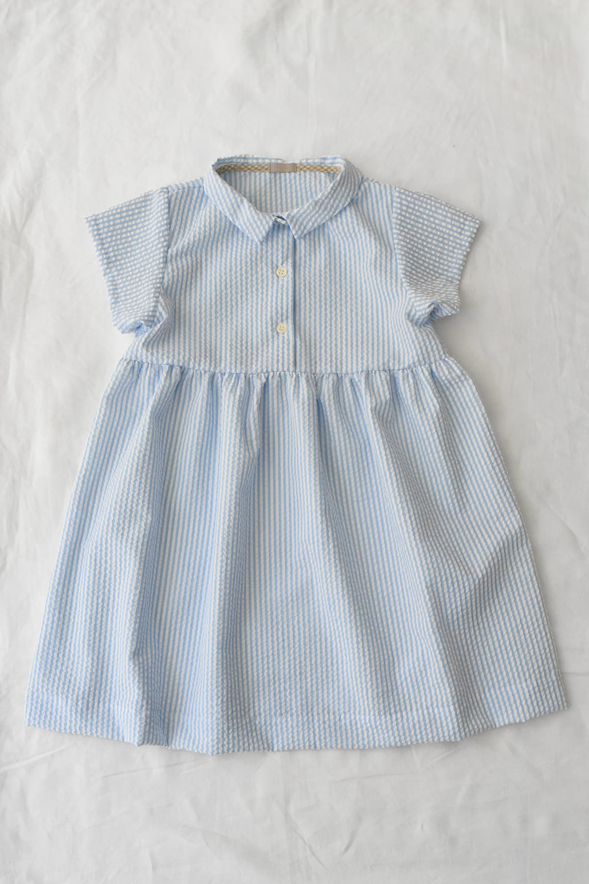 Lightweight blue striped dress with short sleeves and gathered waist