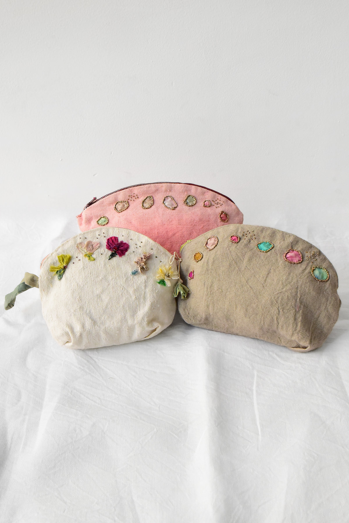 Antonia Rossi handmade pouch featuring vintage bead embroidery on linen fabric.