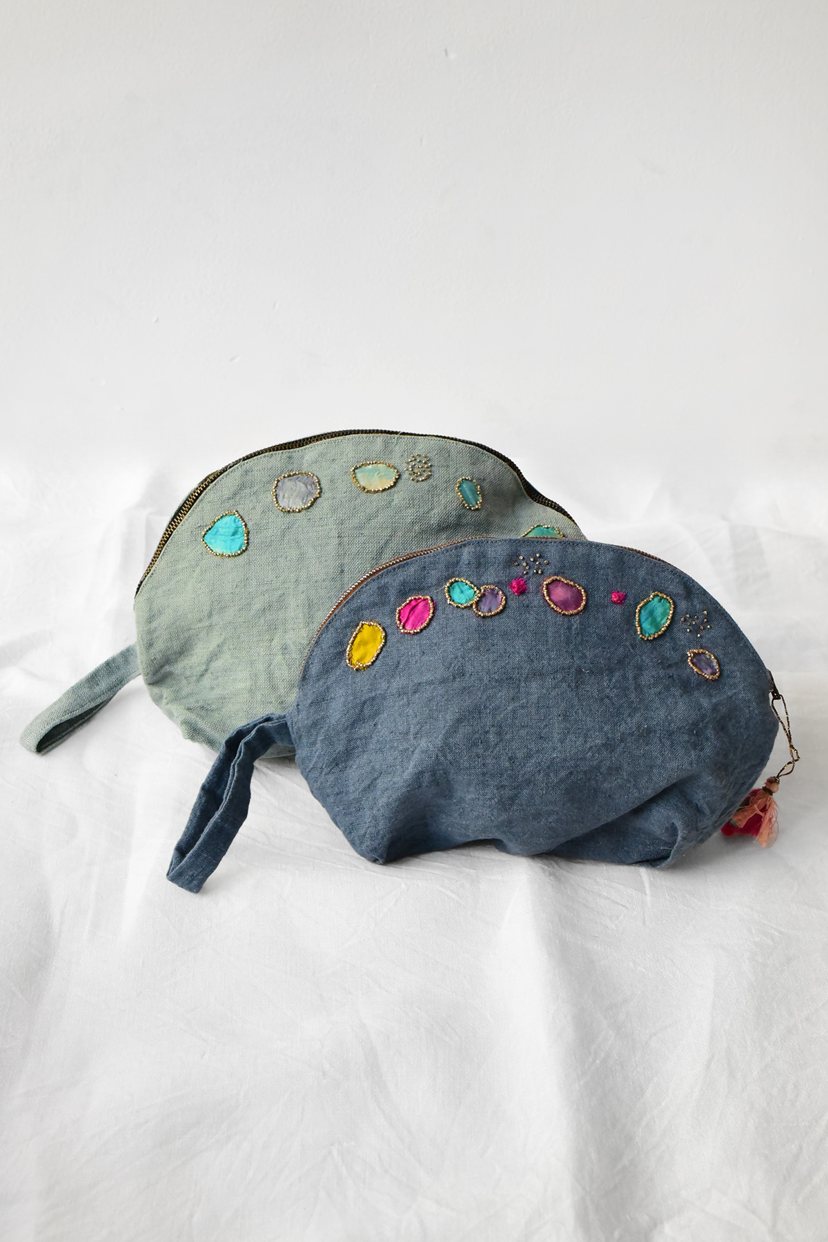 Antonia Rossi handmade pouch featuring vintage bead embroidery on linen fabric.