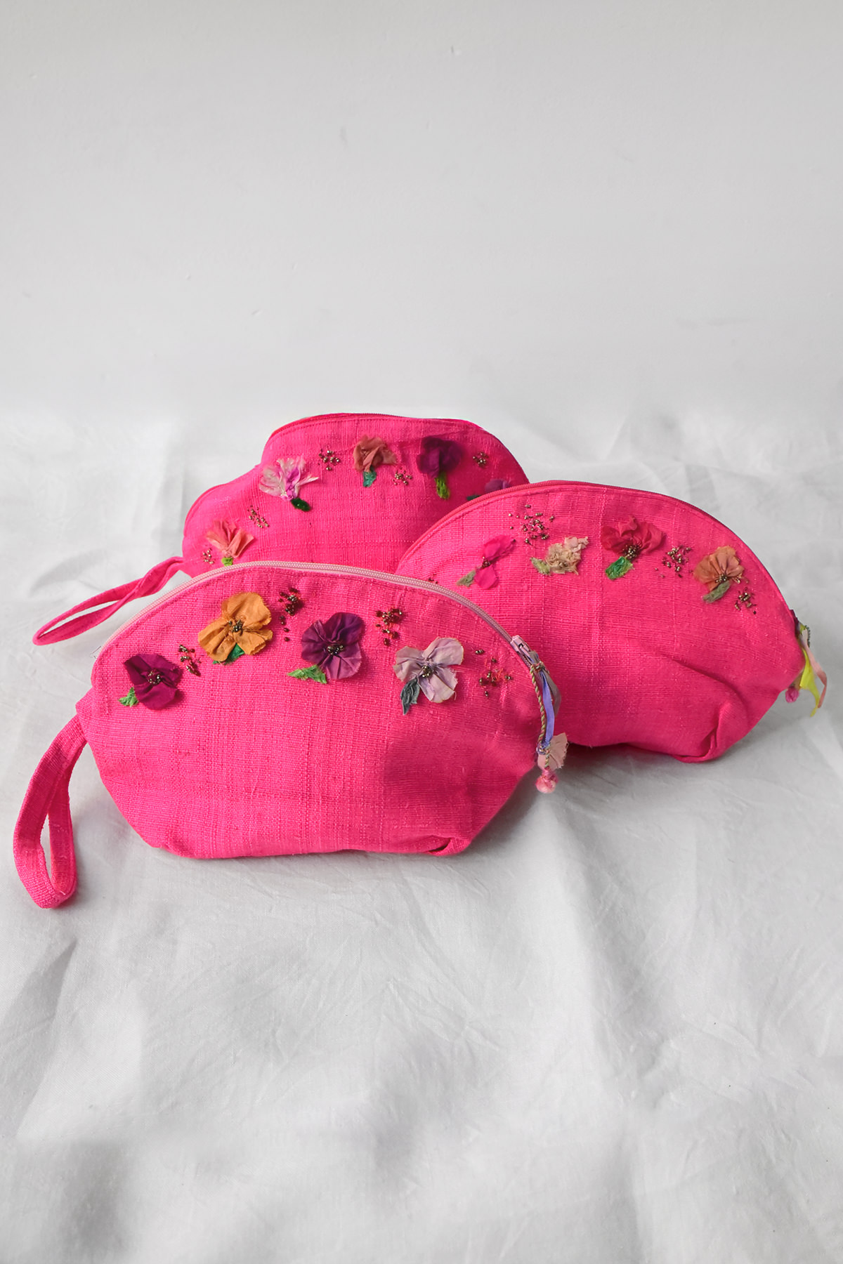 Antonia Rossi handmade pouch featuring vintage bead embroidery on linen fabric.