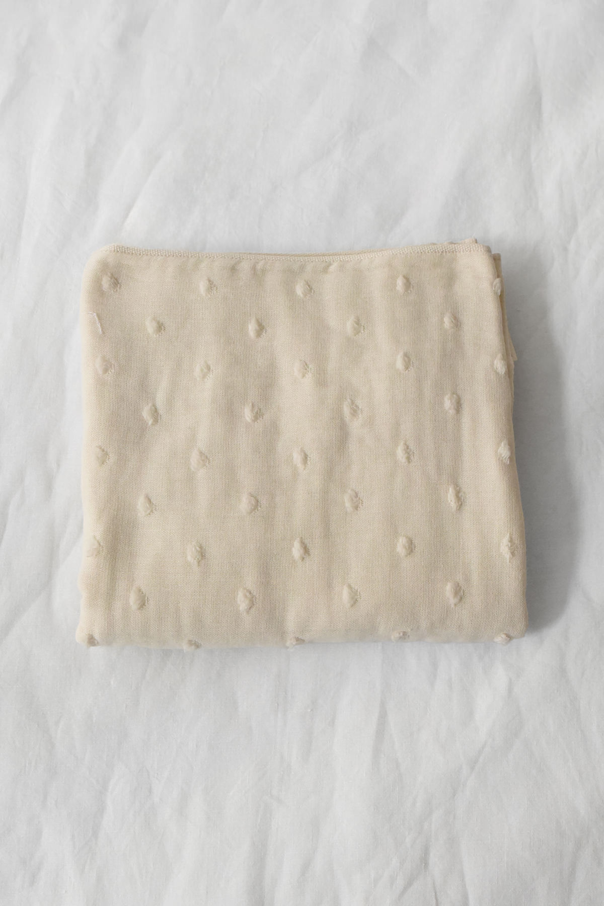 Uchino cream textured cotton hand towel with raised dot pattern, made in Japan