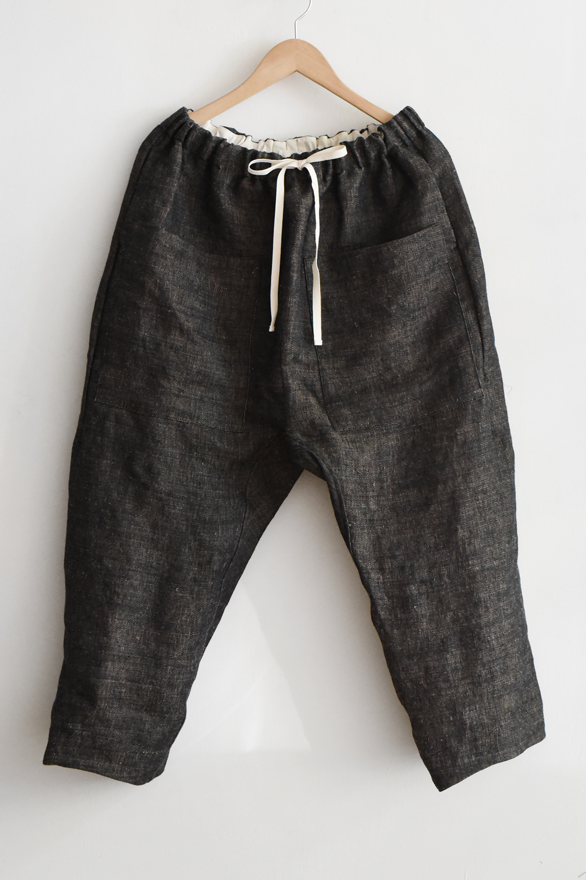 Album di Famiglia black hemp pants with drawstring waist and tapered leg made in Italy