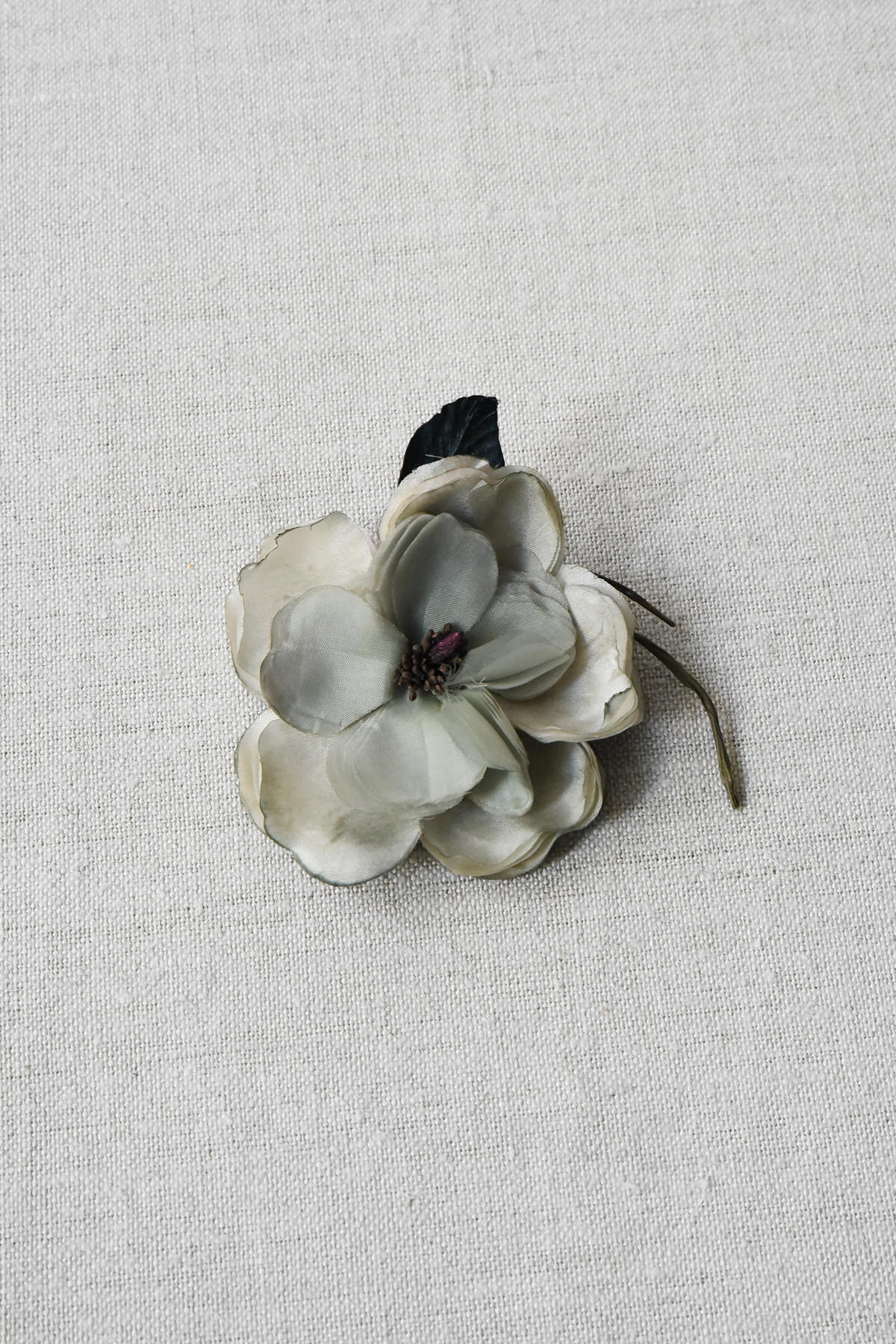 light gray fabric flower brooch approximately 2-3 inches