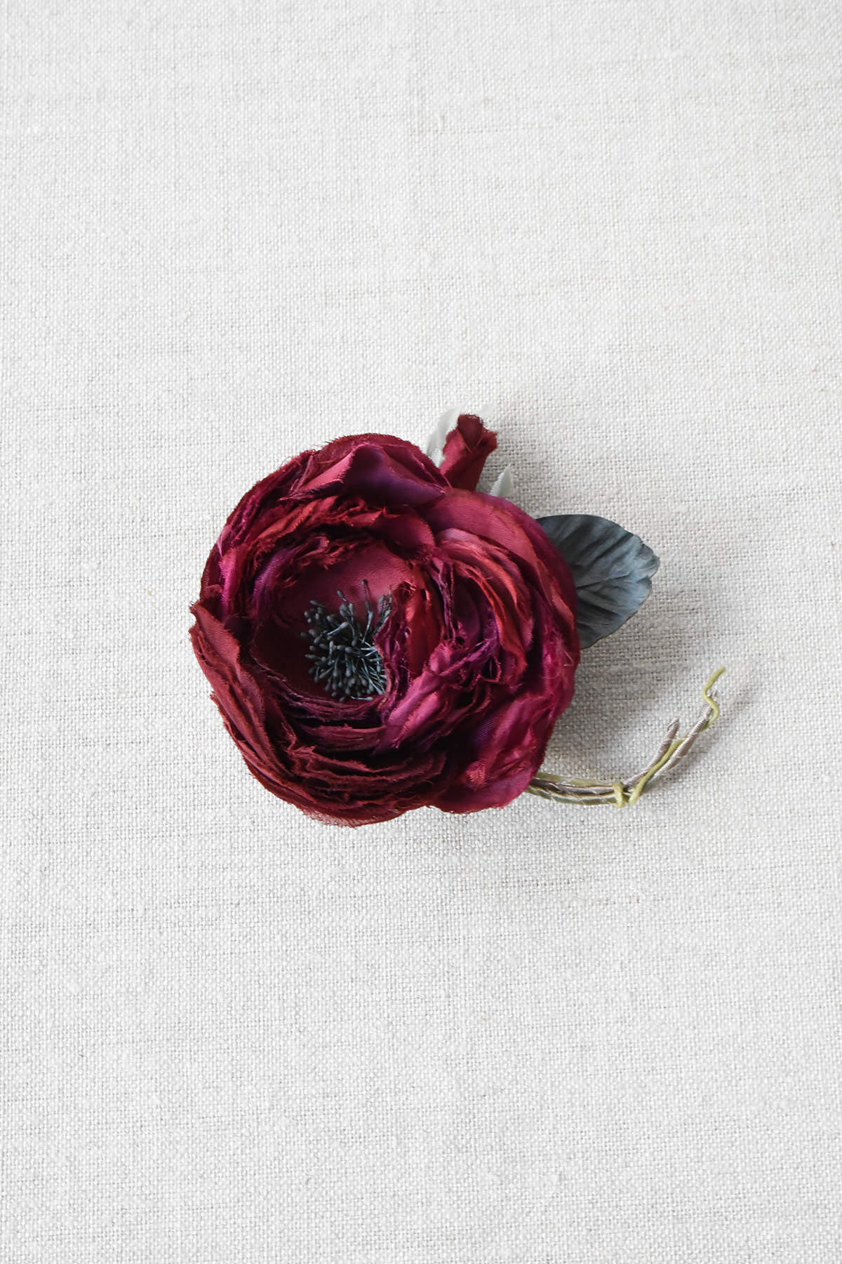 red fabric flower brooch approximately 2-3 inches