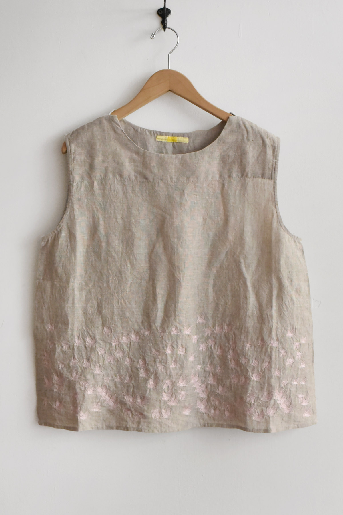 women natural linen sleeveless blouse with embroidery at hem