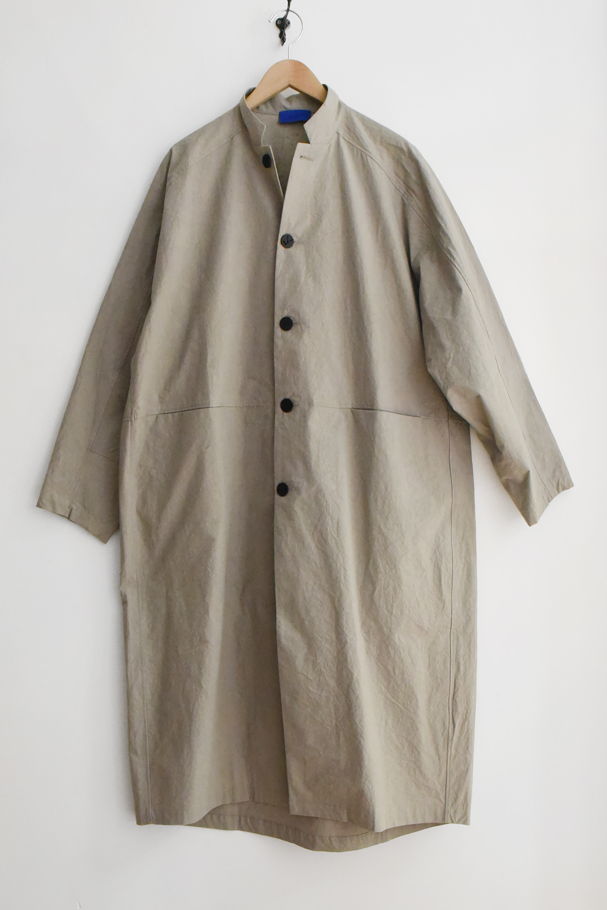 Oyuna Present oversized cotton coat in Japanese woven cotton with curved silhouette and constellation button closure