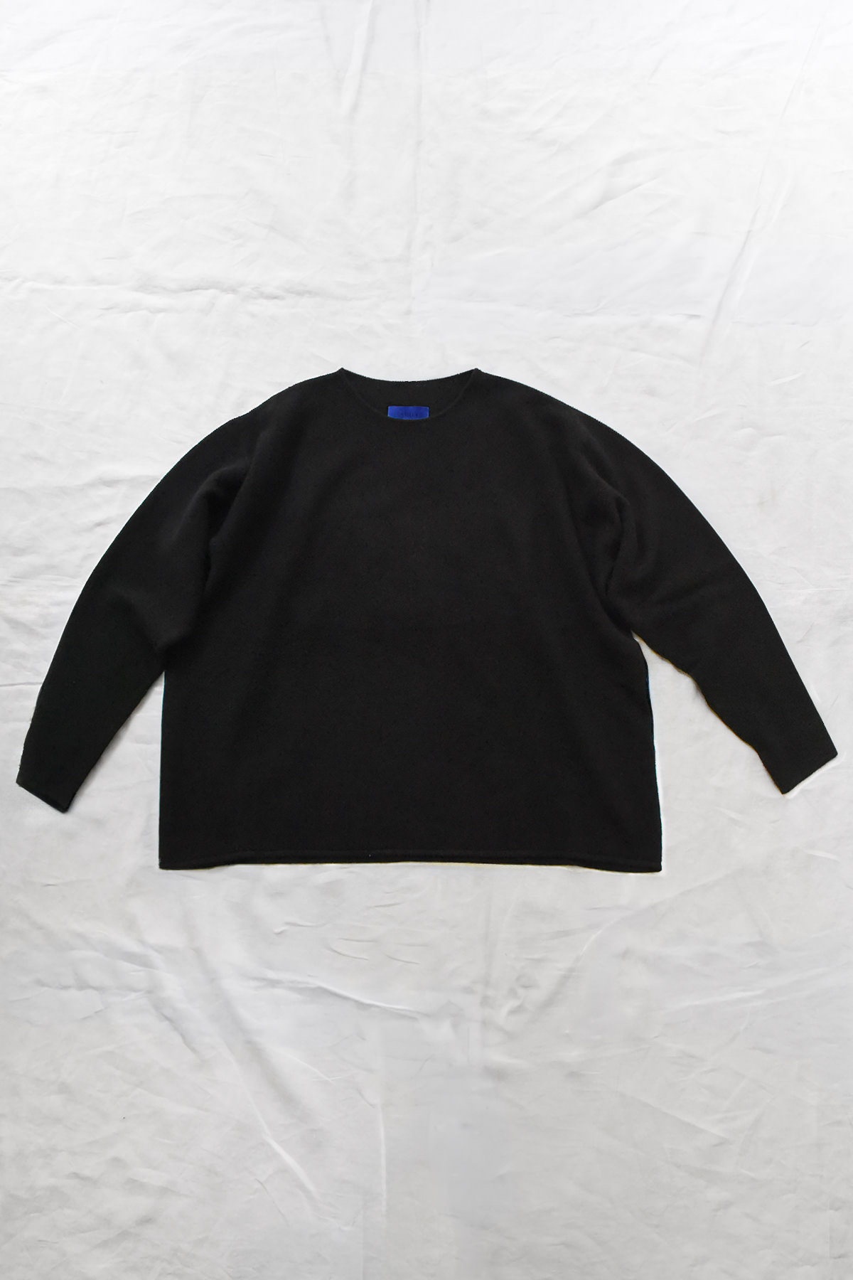 Oyuna Bagi cropped micro moss stitch sweater with relaxed boxy silhouette