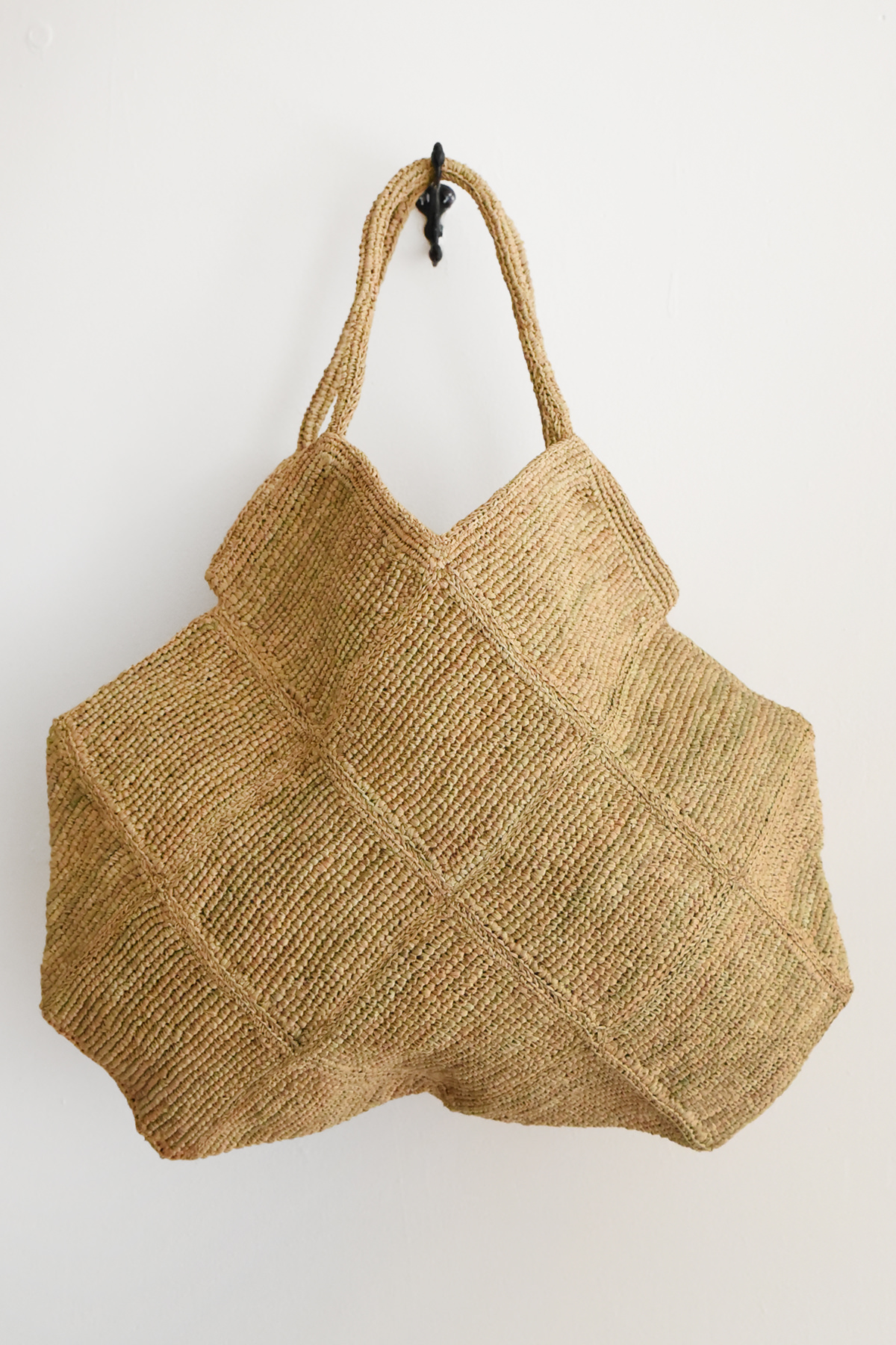 Handmade raffia tote bag with geometric panel construction