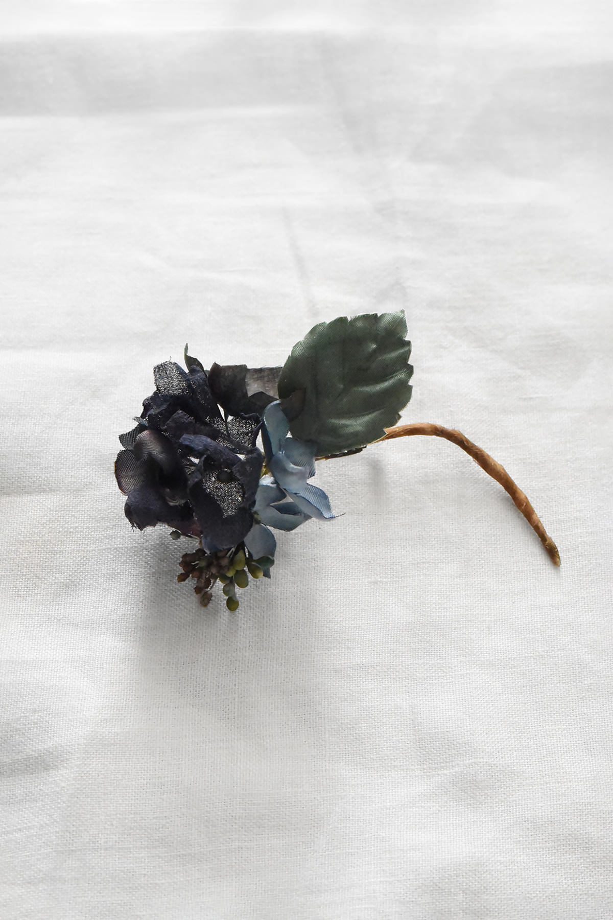 Hand-painted silk floral artwork by Japanese artist Hitoyo featuring deep blue petals, hand-colored leaves, and botanical details