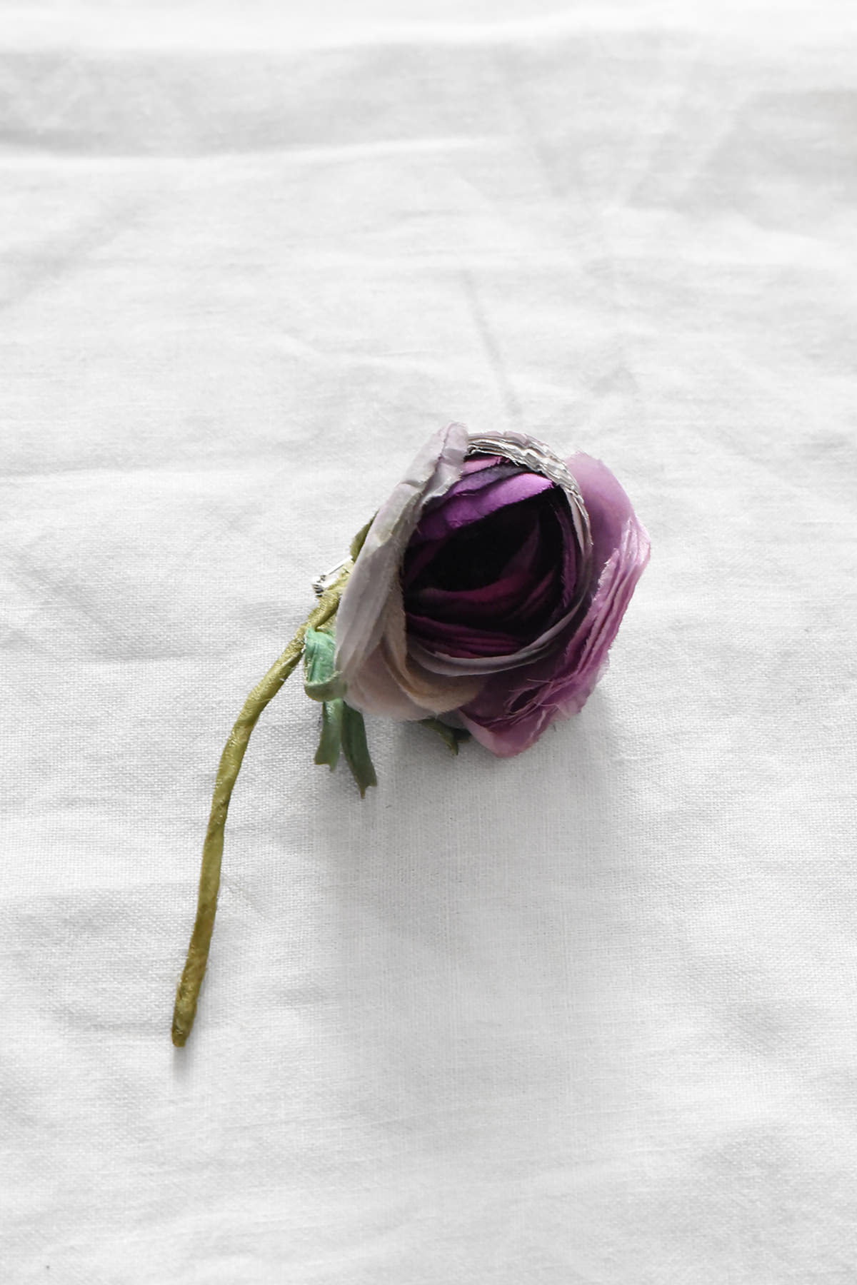Hand-painted silk ranunculus artwork by Japanese artist Hitoyo featuring layered purple and blush petals