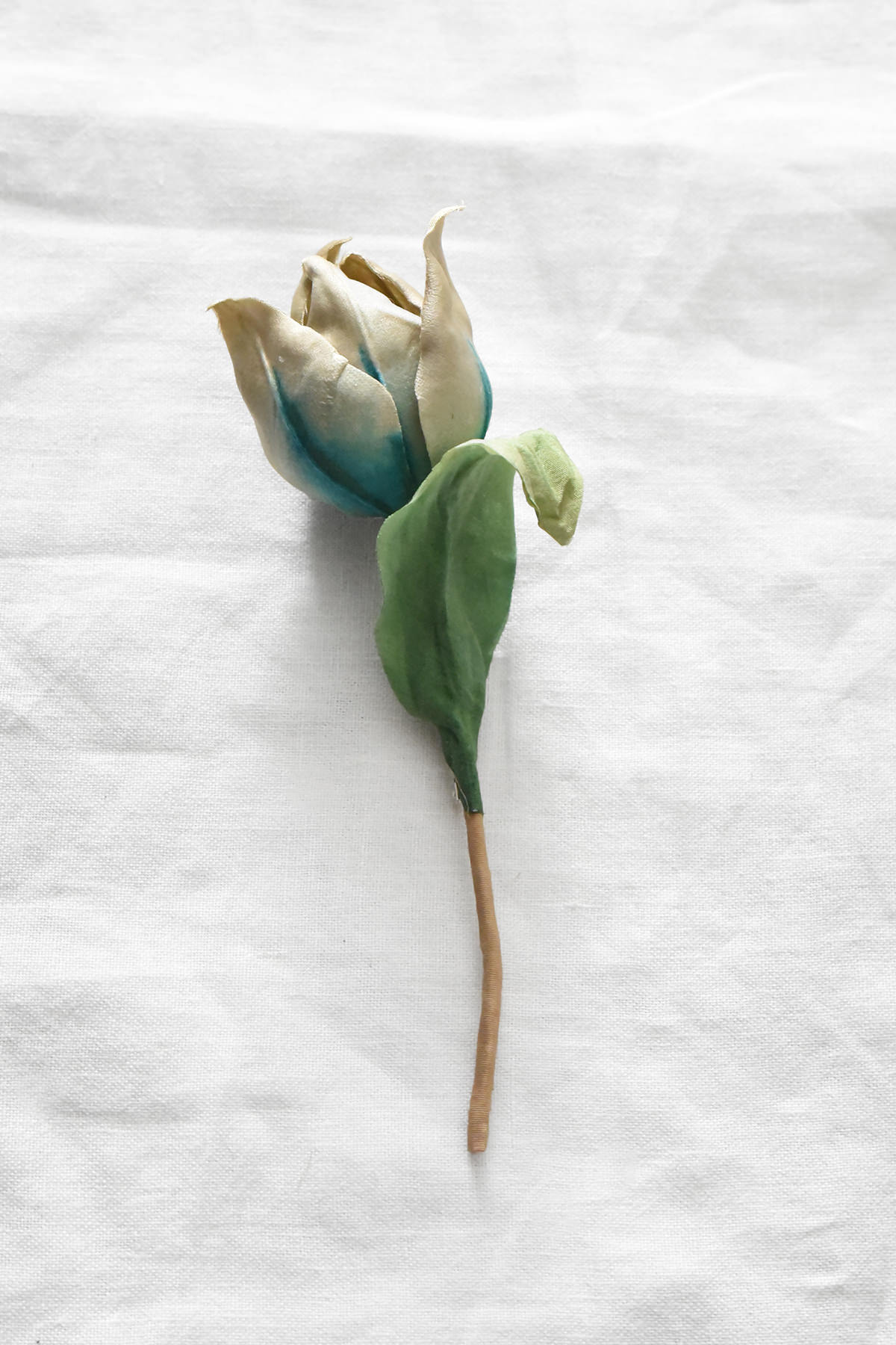 Hand-painted silk tulip bud corsage with ivory petals and blue-green shading by Japanese artist Hitoyo