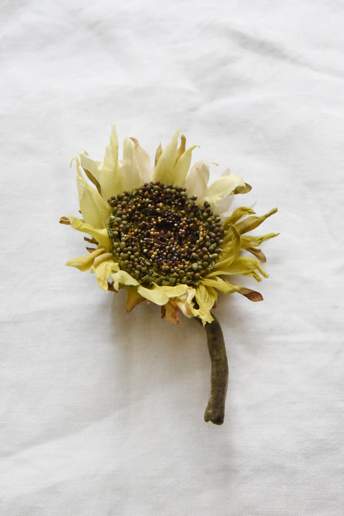 Hand-painted silk sunflower brooch with yellow petals and textured seed center