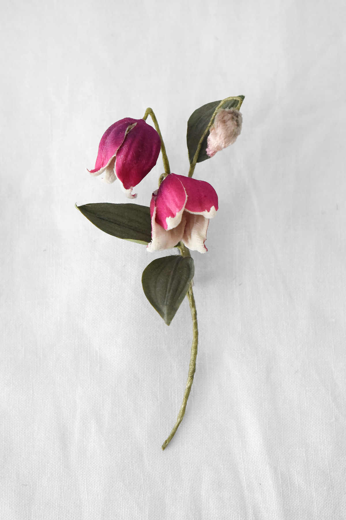 Handmade pink lily of the valley silk flower brooch with delicate bell-shaped blossoms and green leaves