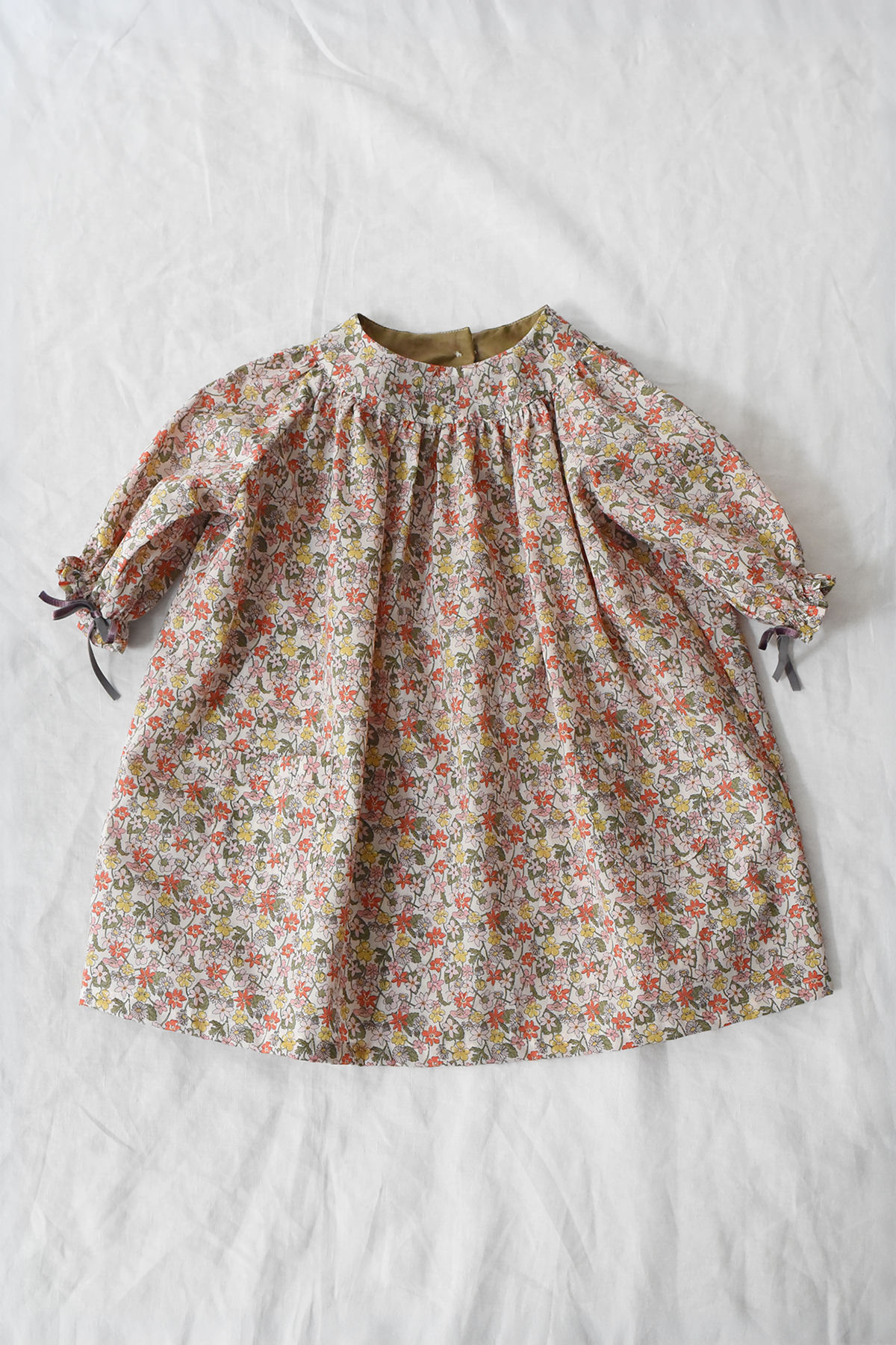Kids' floral cotton dress with gathered neckline and long sleeves