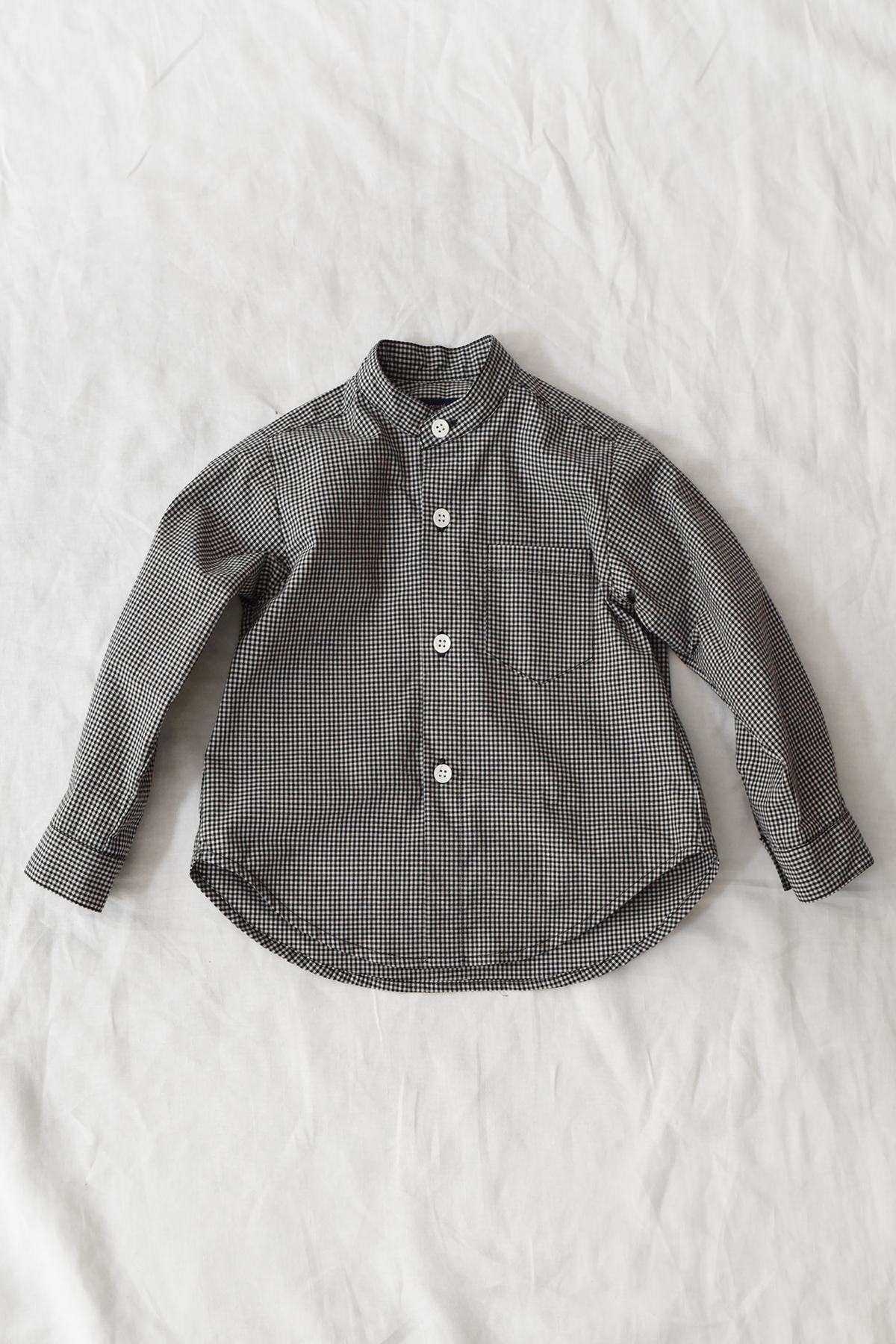 Kid's long sleeve stand collar shirt in black check with box pleat back