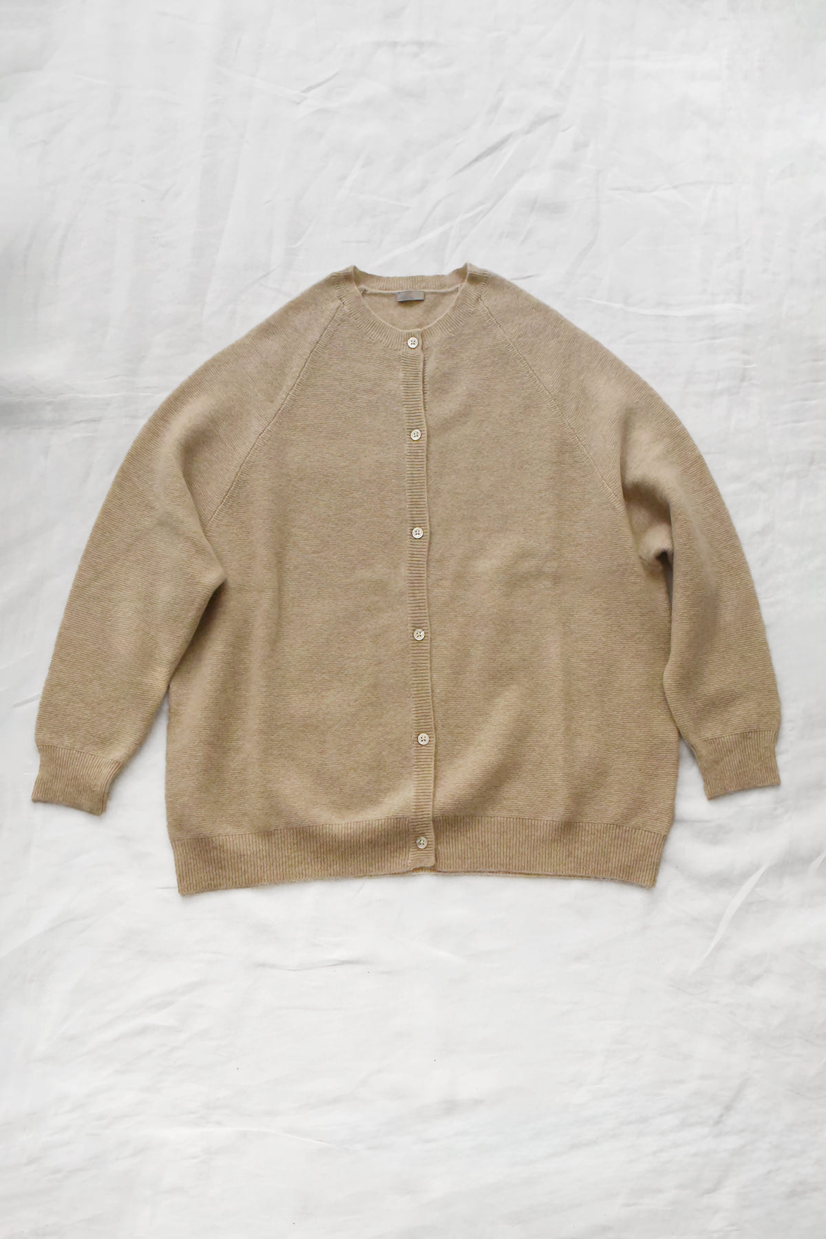 Women's lt. beige cashmere raglan cardigan with crew neck, front button closure, and ribbed trims