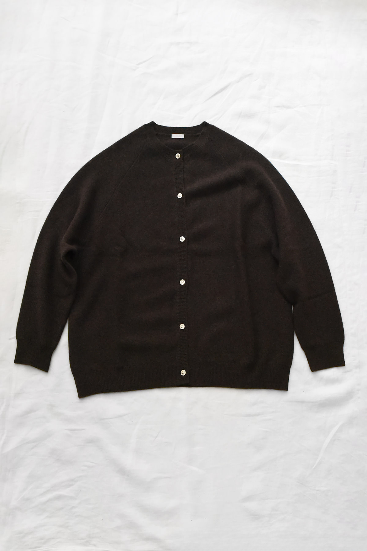 Women's brown cashmere raglan cardigan with crew neck, front button closure, and ribbed trims