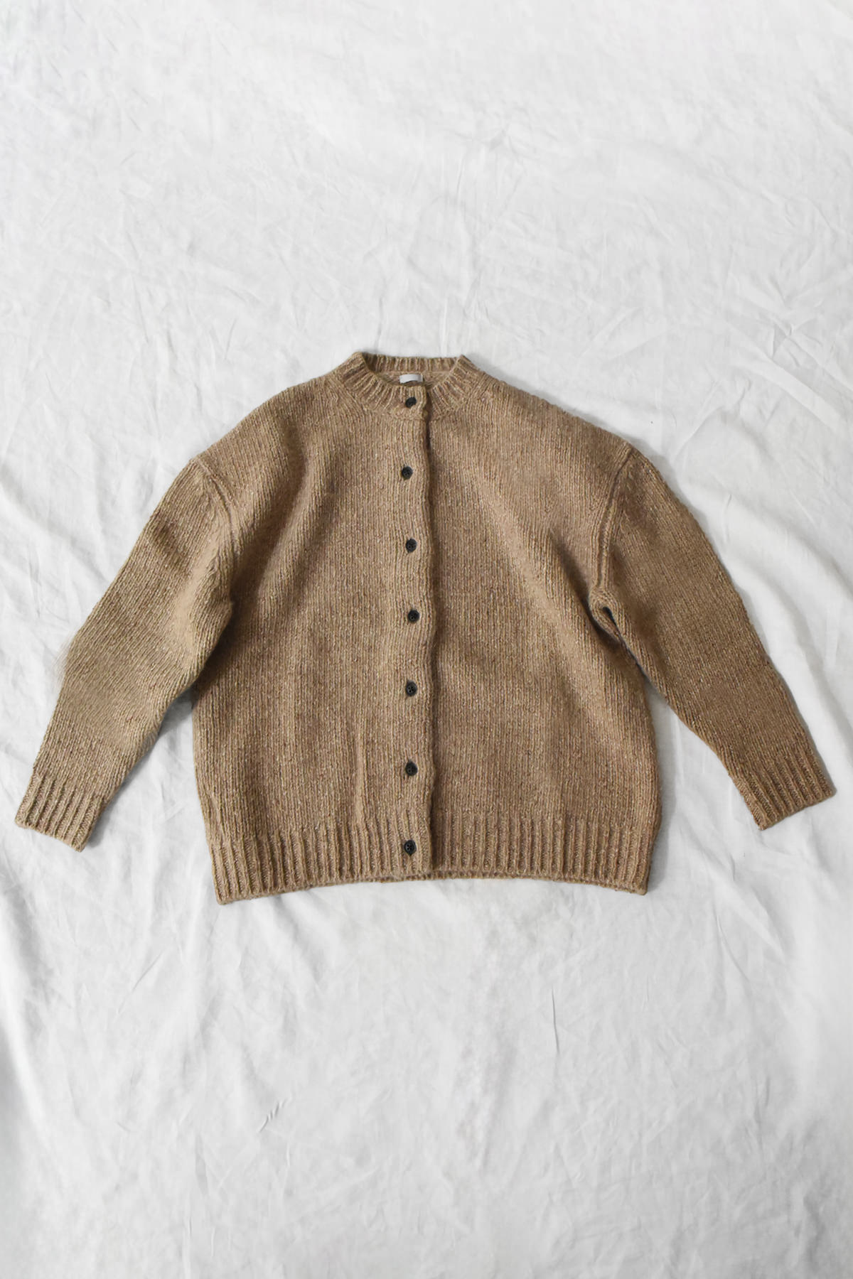 Chunky camel cashmere cardigan with button front and raglan sleeves