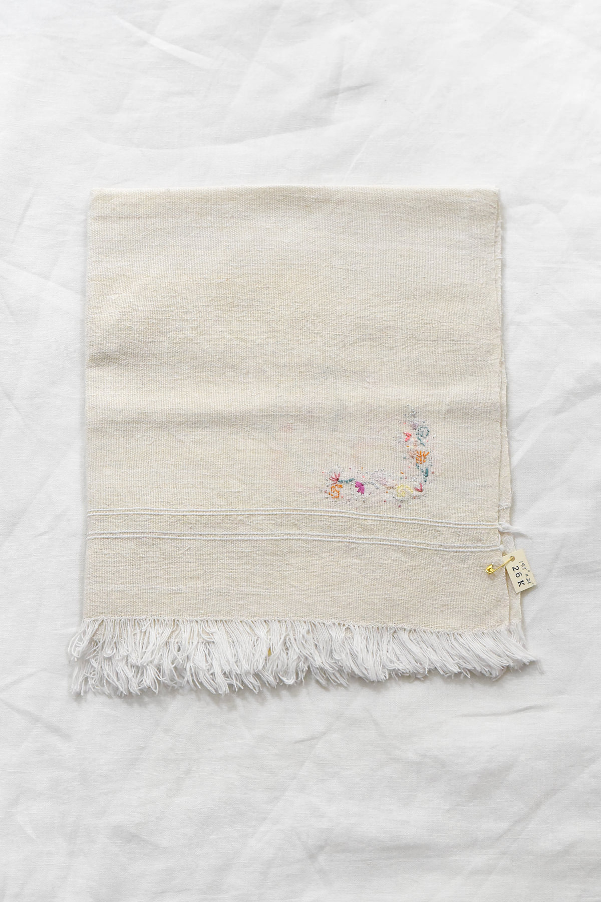 Hand embroidered vintage linen napkin with floral corner embroidery by Antonia Rossi