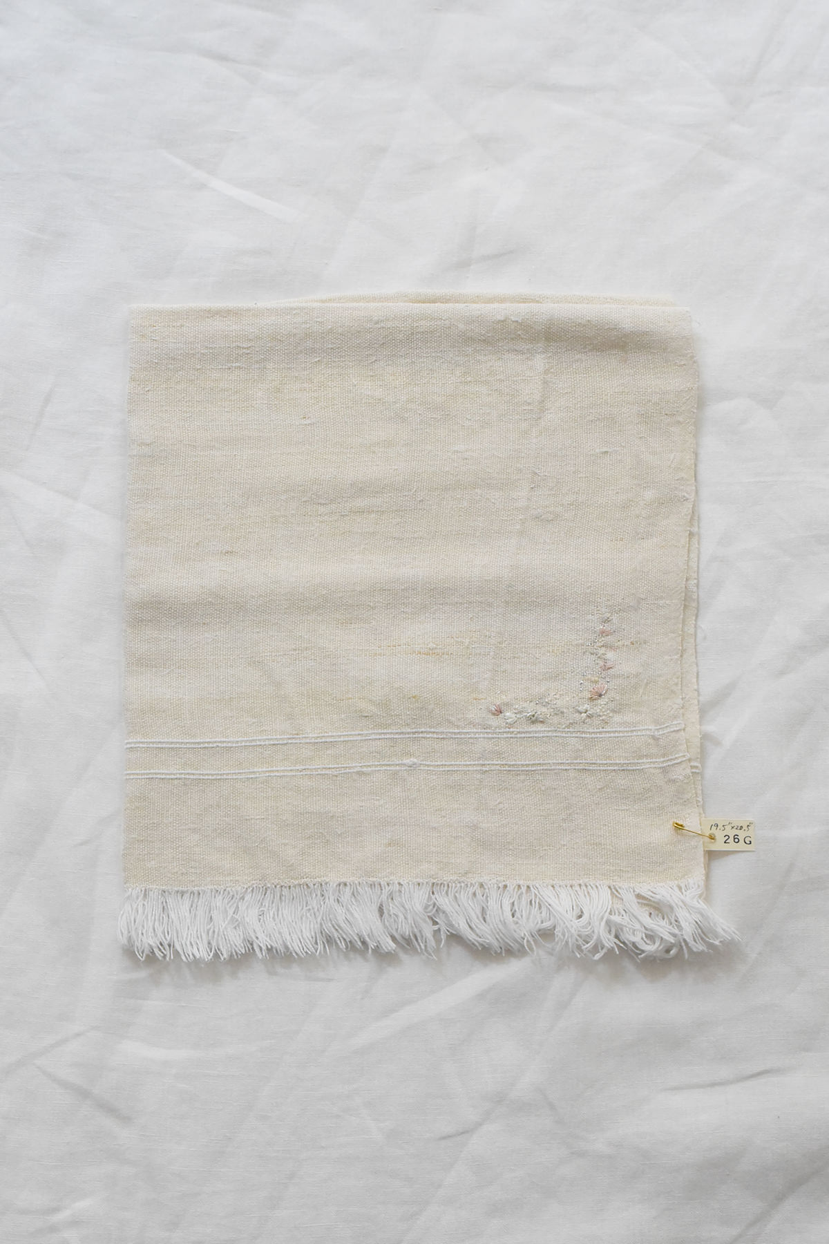 Hand embroidered vintage linen napkin with floral corner embroidery by Antonia Rossi