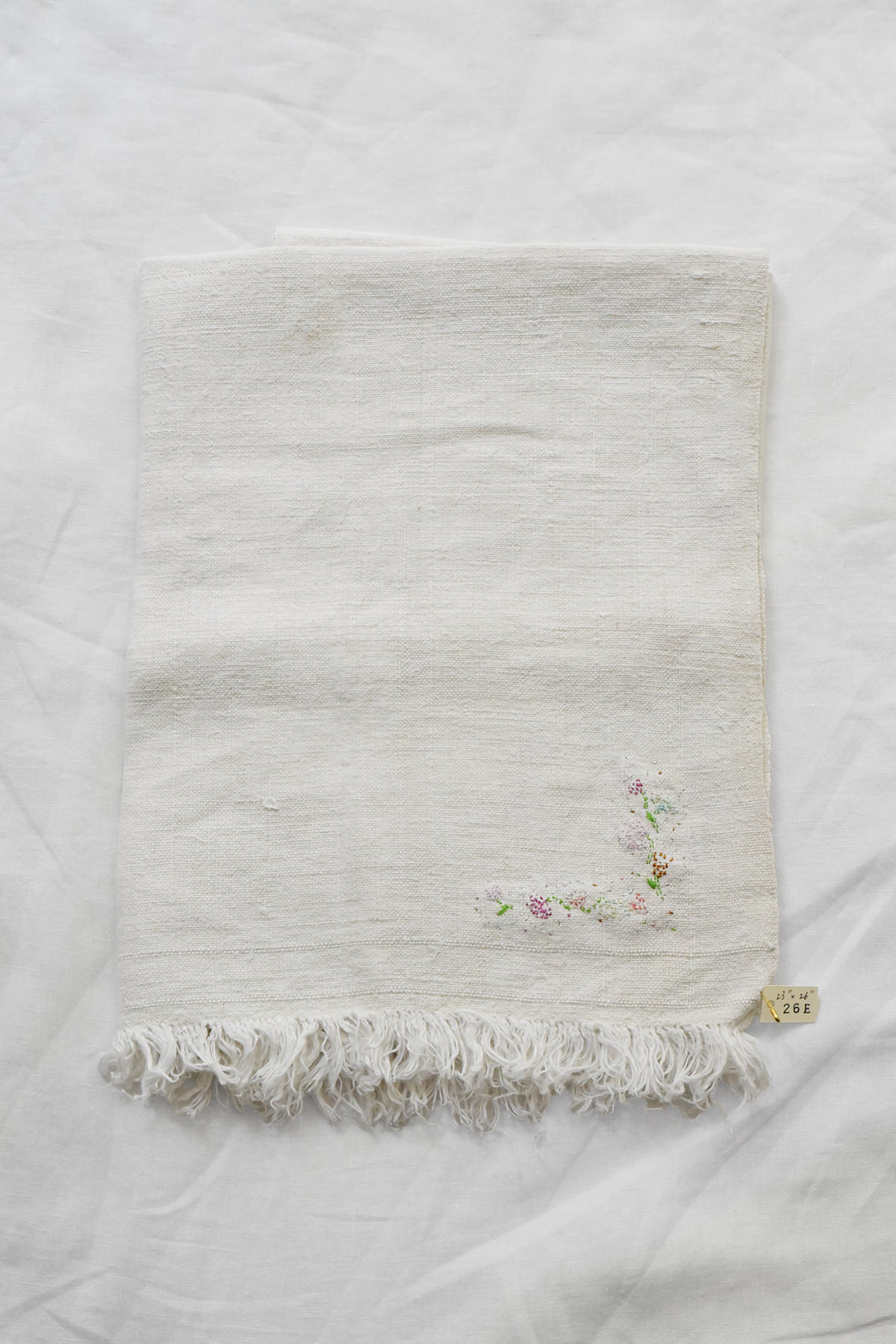 Hand embroidered vintage linen napkin with floral corner embroidery by Antonia Rossi