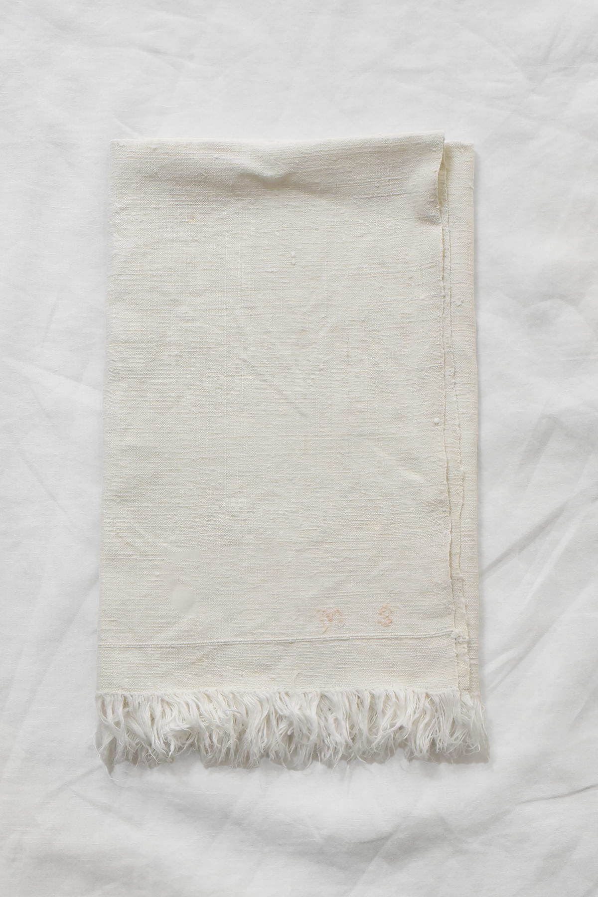 French vintage linen napkin with red embroidered initials and fringed edge