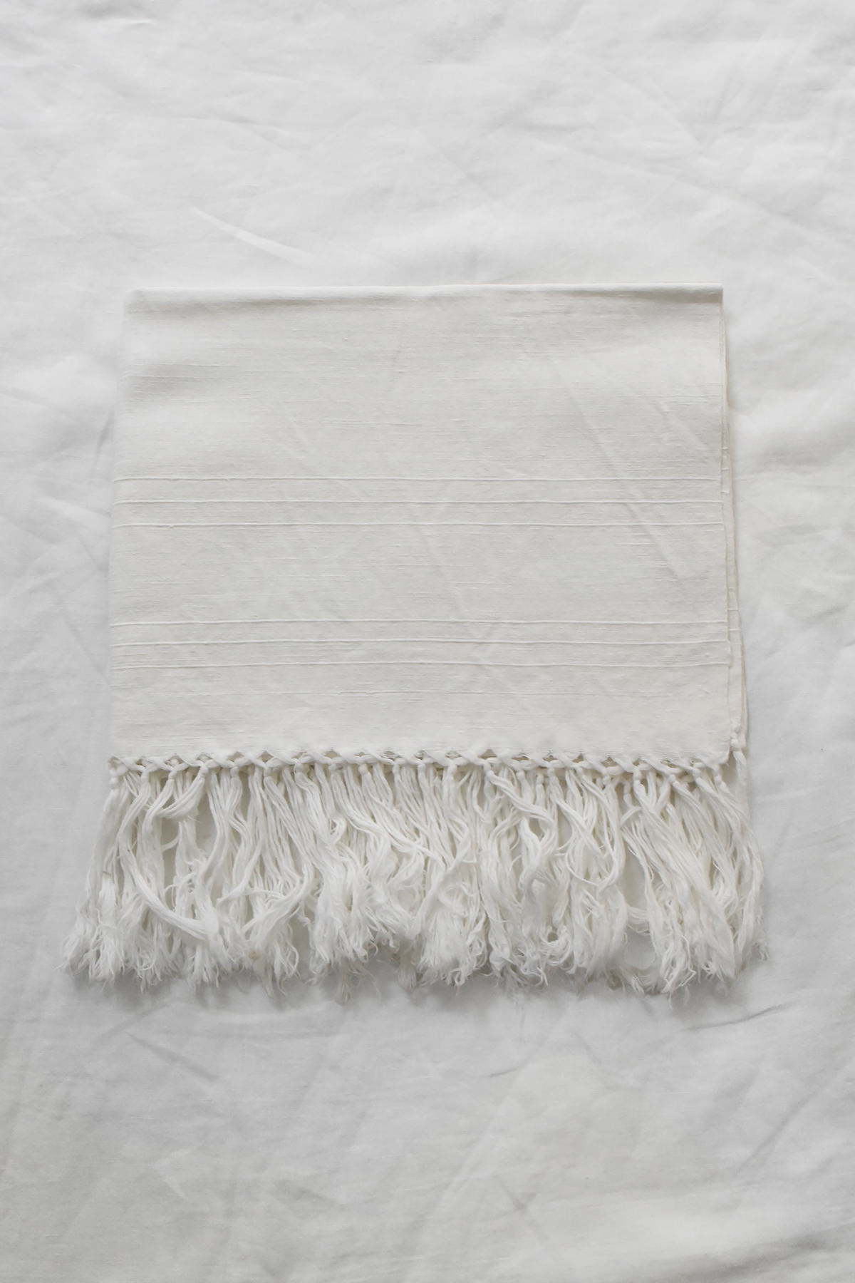 Hand embroidered vintage linen napkin with floral corner embroidery by Antonia Rossi