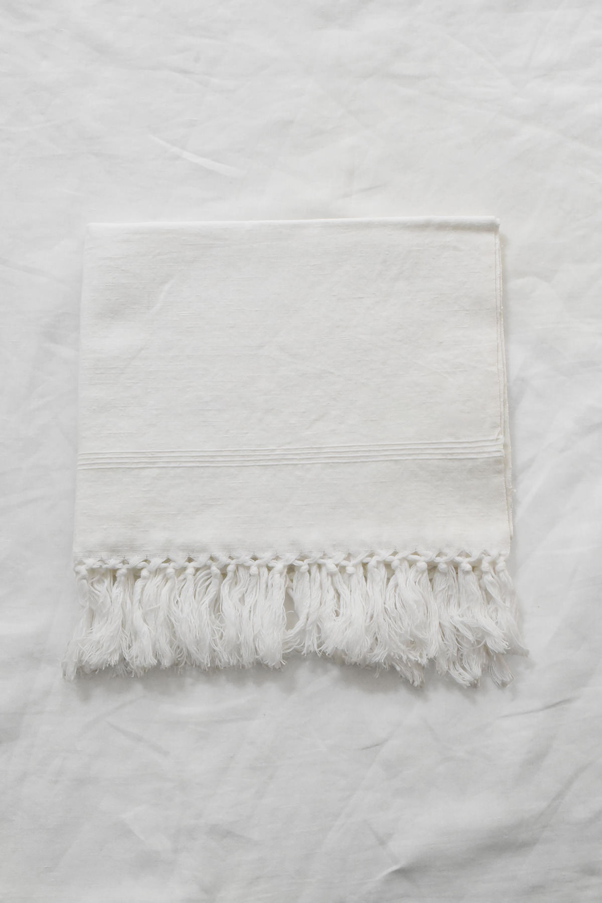 Hand embroidered vintage linen napkin with floral corner embroidery by Antonia Rossi