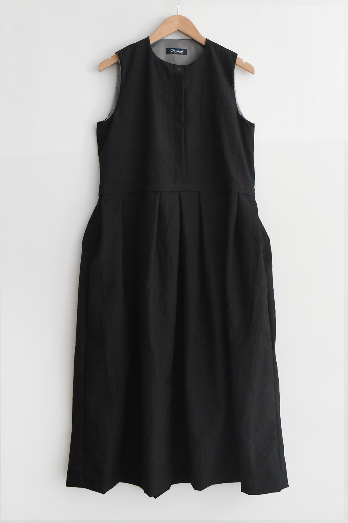 Bergfabel Kathrine Dress in black stripe with sleeveless design and pleated skirt
