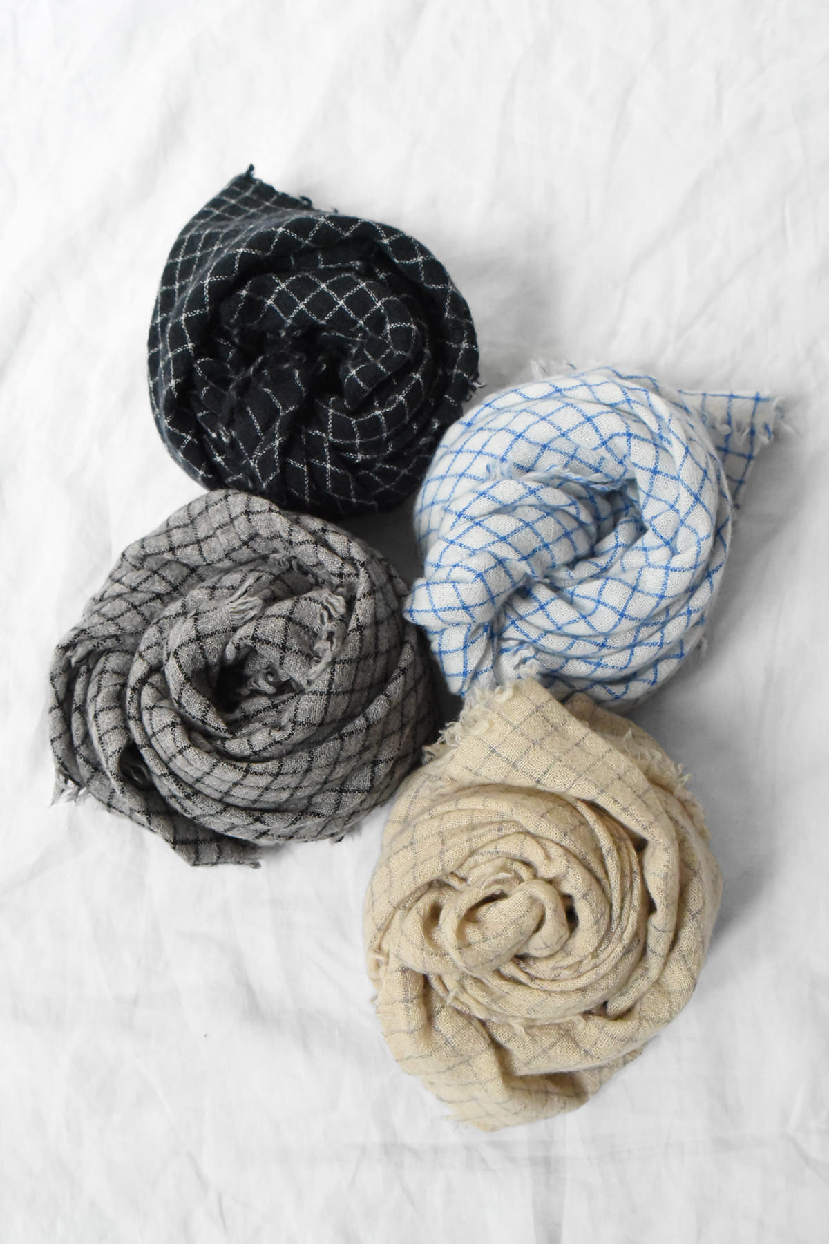 Four 100% cashmere check scarves in different color combinations