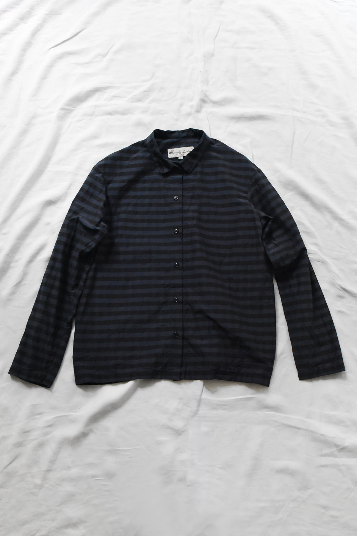 Manuelle Guibal, 7143 Shirt YSH - Noctis long-sleeved button-down shirt with a dark navy and black horizontal stripe pattern.