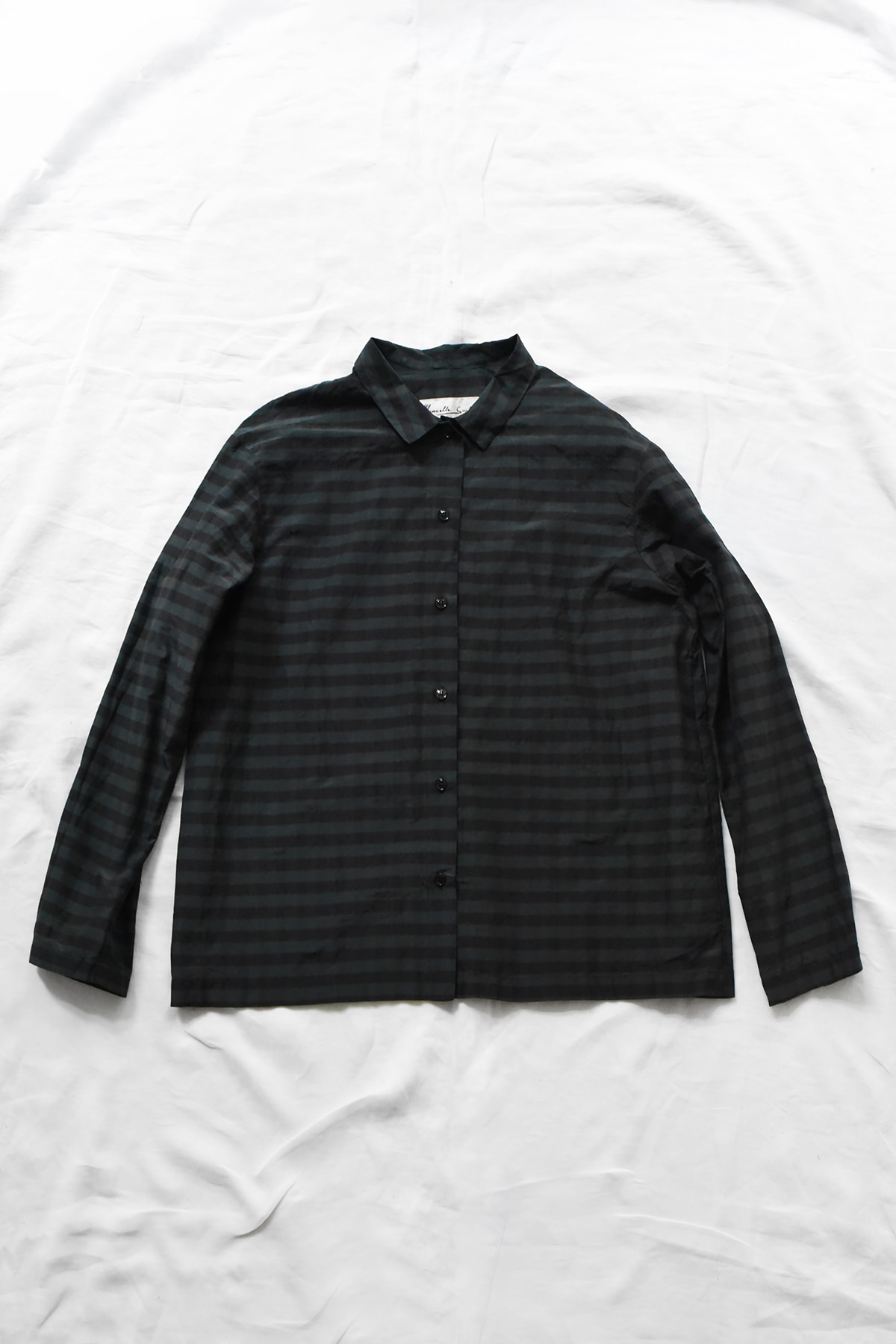 Manuelle Guibal, 7143 Shirt YSH - Bottle, a dark green button-down shirt with a subtle horizontal stripe pattern.